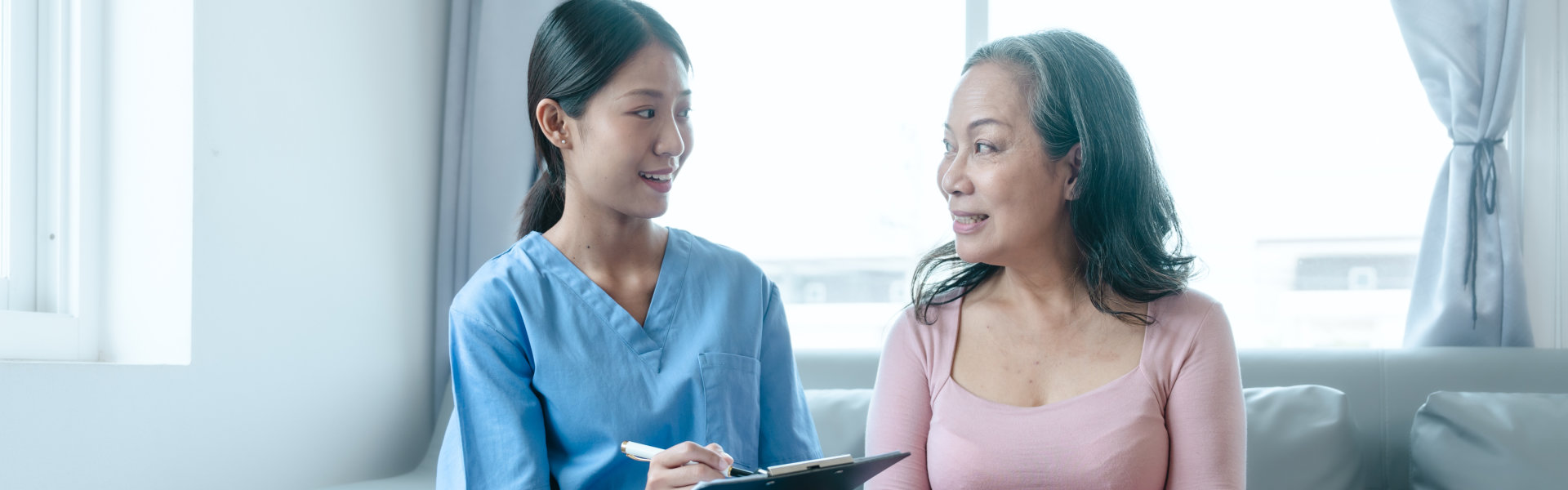 Caregiver talking to her patient