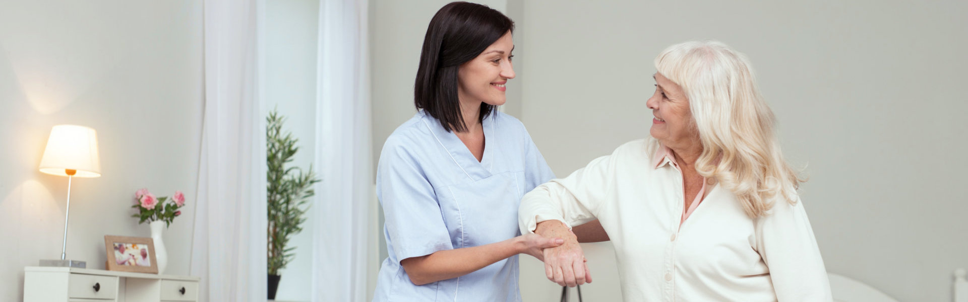 female caregiver assisting patient