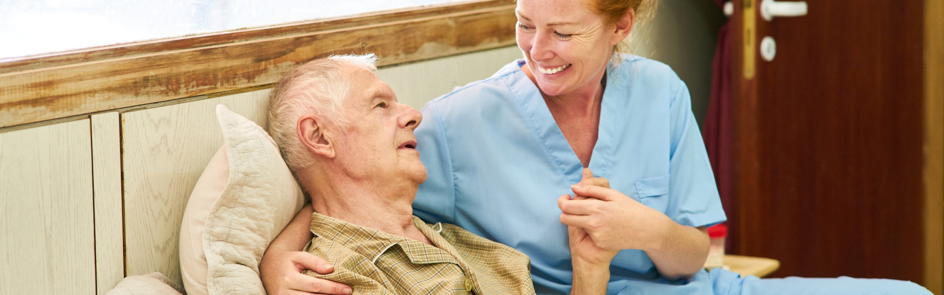 male patient having fun with female caregiver