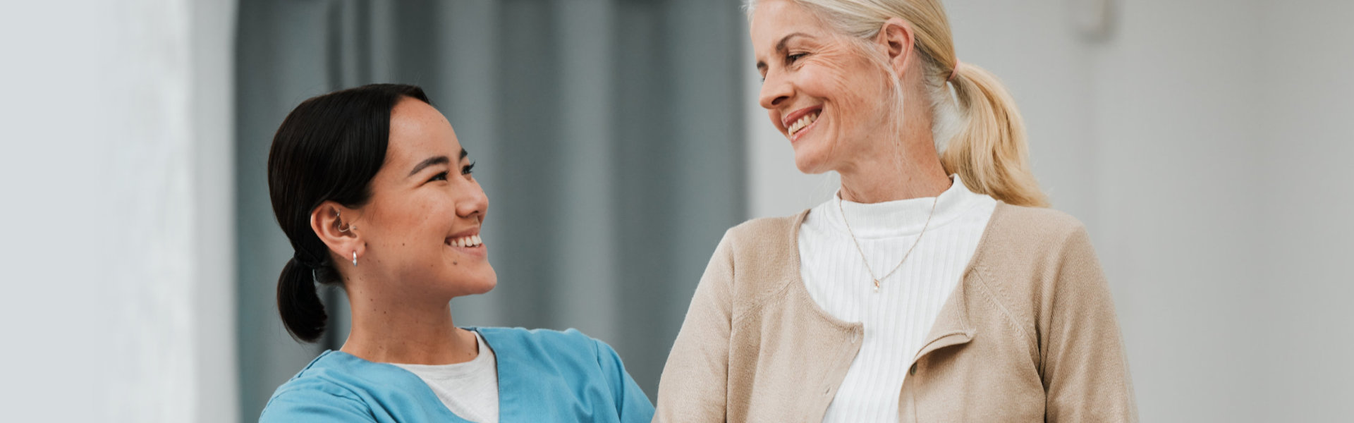 Caregiver smiling to her patient